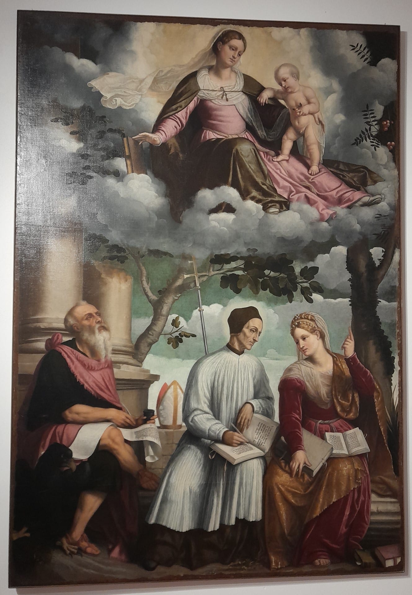 La Madonna col Bambino in gloria, San Giovanni Evangelista, il beato